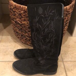 Tall suede boots that zip up the back.